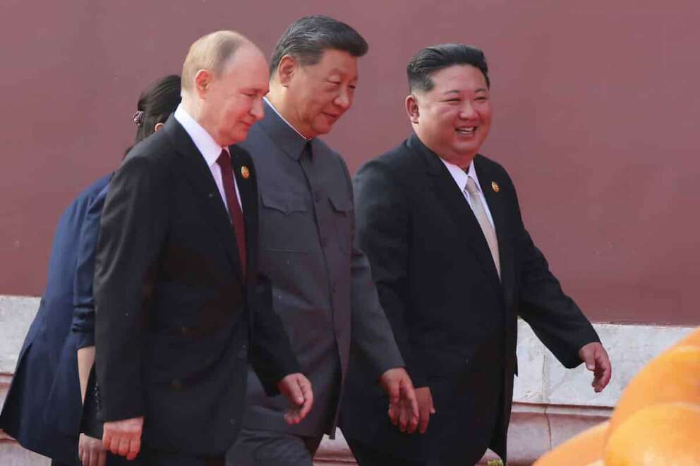 In this photo provided by the North Korean government, from left, Russian President Vladimir Putin, Chinese President Xi Jinping and North Korean leader Kim Jong Un walk to attend a military parade marking the 80th anniversary of the end of World War II at the Tiananmen Square in Beijing Wednesday, Sept. 3, 2025. Independent journalists were not given access to cover the event depicted in this image distributed by the North Korean government. The content of this image is as provided and cannot be independently verified. (Korean Central News Agency/Korea News Service via AP)