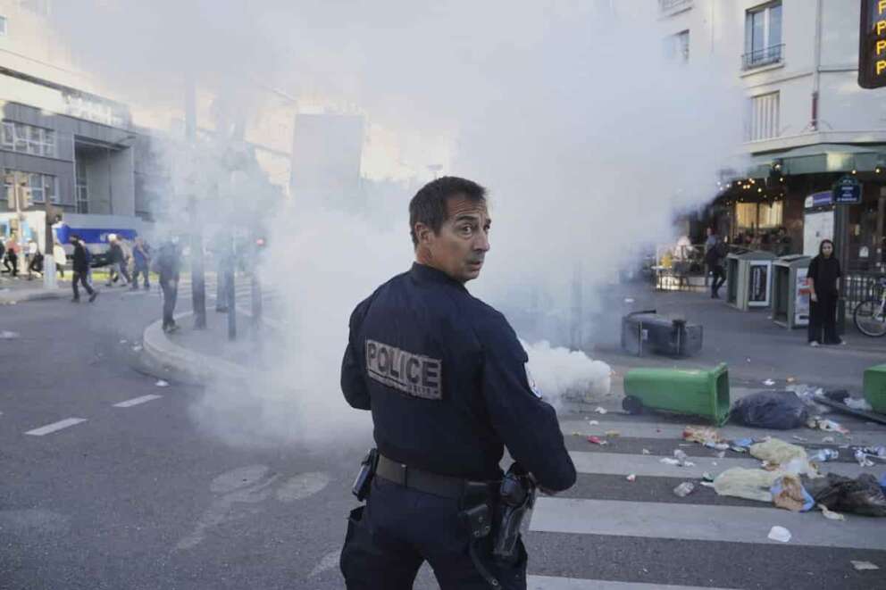 A police officer stands next to bins placed on a street to block it during the “Bloquons Tout” (Block Everything) protest movement in Paris, Wednesday, Sept. 10, 2025. (AP Photo/Thibault Camus) associated Press / LaPresse Only italy and spain