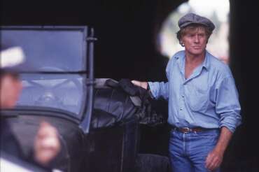 FILE – Director Robert Redford appears on set during the filming of “A River Runs Through It,” near Livingston, Mont., on  June 17, 1991. (Linda Best/Bozeman Daily Chronicle via AP, File)