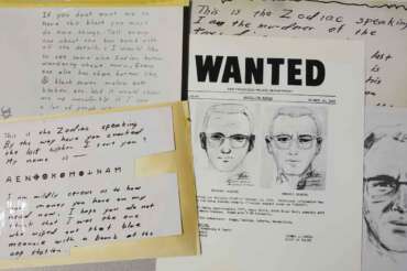 FILE – In this May 3, 2018, file photo, a San Francisco Police Department wanted bulletin and copies of letters sent to the San Francisco Chronicle by a man who called himself Zodiac are displayed in San Francisco. A coded letter mailed to a San Francisco newspaper by the Zodiac serial killer in 1969 has been deciphered by a team of amateur sleuths from the United States, Australia and Belgium, the San Francisco Chronicle reported Friday, Dec. 11, 2020. (AP Photo/Eric Risberg, File)