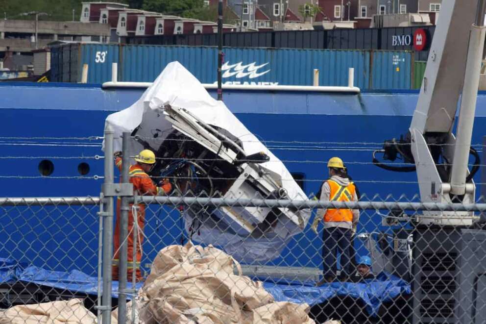 Debris from the Titan submersible, recovered from the ocean floor near the wreck of the Titanic, is unloaded from the ship Horizon Arctic at the Canadian Coast Guard pier in St. John’s, Newfoundland, Wednesday, June 28, 2023. (Paul Daly/The Canadian Press via AP)