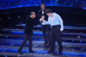 Olly, Carlo Conti and Alessandro Cattelan during the final evening of 75th edition of the Sanremo Italian Song Festival at the Ariston Theatre in Sanremo, northern Italy – Saturday February 15, 2025. Entertainment. (Photo by Marco Alpozzi/LaPresse)
