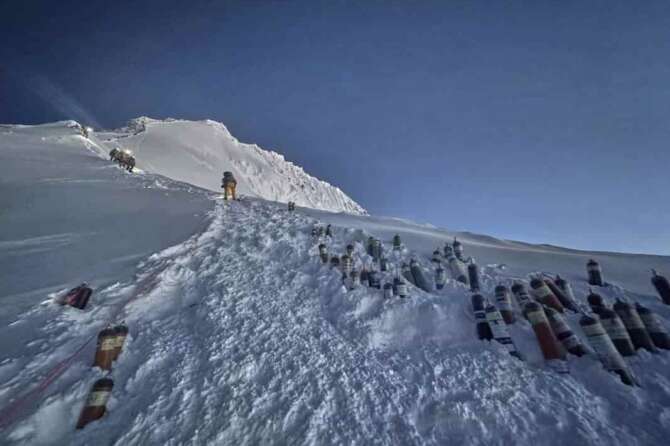 Oxygen cylinders are kept on a slope on the way to the summit of Mount Everest in Nepal, May 18, 2025. (AP Photo/Kunga Sherpa)