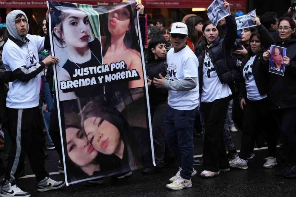 People hold picture of Brenda del Castillo, Morena Verdi and Lara Gutierrez, as they protest their torture and killing, which authorities blame on drug trafficking gangs, during a demonstration called by feminist groups in Buenos Aires, Argentina, Saturday, Sept. 27, 2025. (AP Photo/Gustavo Garello)