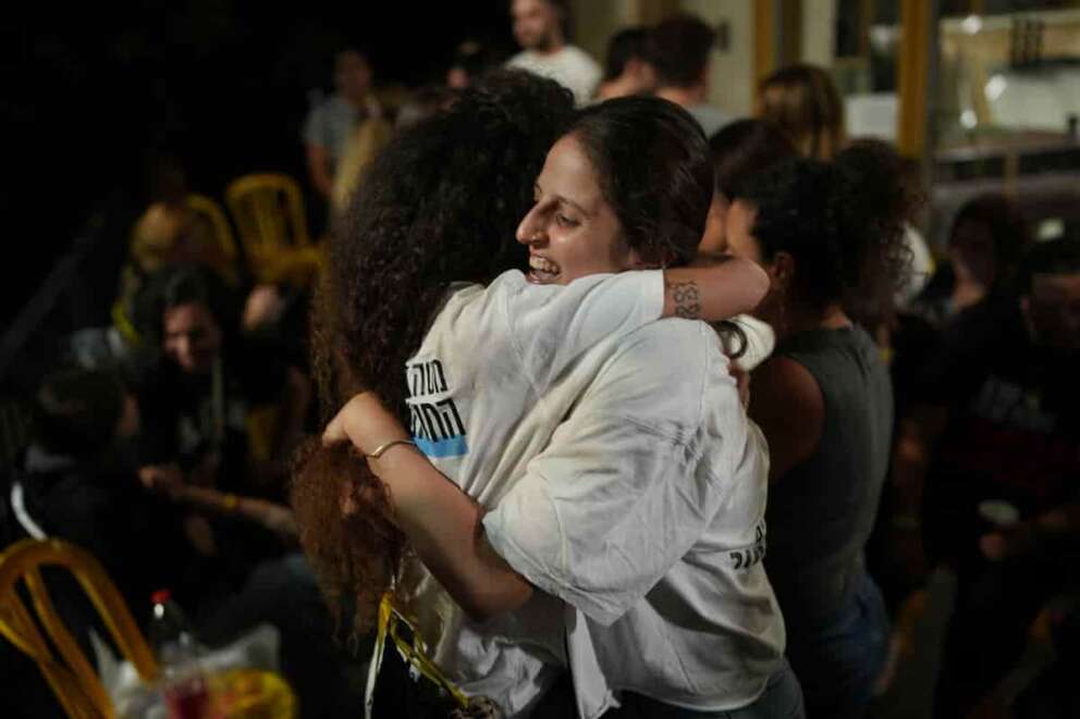 Relatives and supporters of Israeli hostages held by Hamas in the Gaza Strip celebrate after the announcement that Israel and Hamas have agreed to the first phase of a peace plan, as they gather at a plaza known as the hostages square in Tel Aviv, Israel, Thursday, Oct. 9, 2025. (AP Photo/Emilio Morenatti) Associated Press/LaPresse