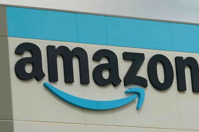 FILE – The Amazon logo is pictured at the Amazon Robotic Sorting Fulfillment Center in Madison County, Miss., Aug. 11, 2022. (AP Photo/Rogelio V. Solis, File)