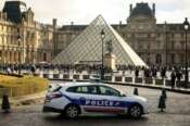 A police car parks in the courtyard of the Louvre museum, one week after the robbery, Sunday, Oct. 26, 2025 in Paris. The Paris prosecutor said on Sunday that a number of suspects have been arrested over the theft of crown jewels from Paris’ Louvre museum last weekend. (AP Photo/Thomas Padilla)