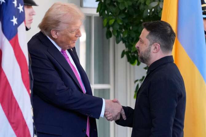 President Donald Trump, left, greets Ukraine’s President Volodymyr Zelenskyy at the White House, Friday, Oct. 17, 2025, in Washington. (AP Photo/Alex Brandon)