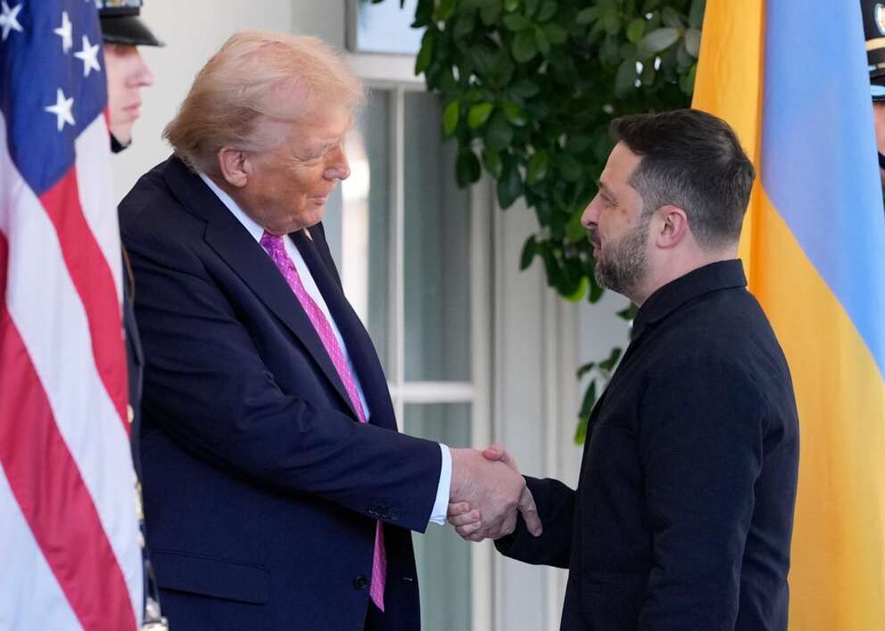 President Donald Trump, left, greets Ukraine’s President Volodymyr Zelenskyy at the White House, Friday, Oct. 17, 2025, in Washington. (AP Photo/Alex Brandon)