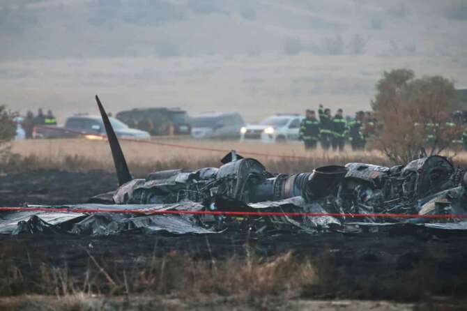 Debris is seen at a crash site of a Turkish military cargo plane in Georgia’s Sighnaghi municipality, close to the Azerbaijani border on Wednesday, Nov. 12, 2025. (AP Photo/Zurab Tsertsvadze)