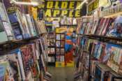 A life-sized cutout of Superman is seen amidst shelves of graphic novels and pop culture memorabilia inside the iconic Golden Apple Comics store, Tuesday, Nov. 18, 2025, in Los Angeles. (AP Photo/Damian Dovarganes)
