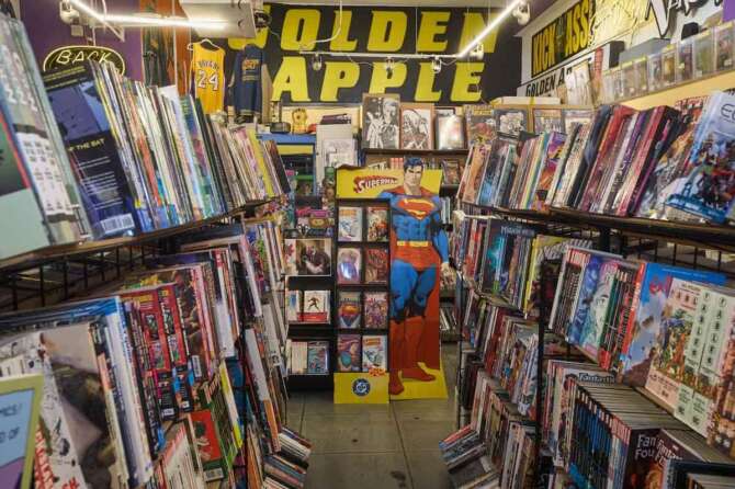 A life-sized cutout of Superman is seen amidst shelves of graphic novels and pop culture memorabilia inside the iconic Golden Apple Comics store, Tuesday, Nov. 18, 2025, in Los Angeles. (AP Photo/Damian Dovarganes)