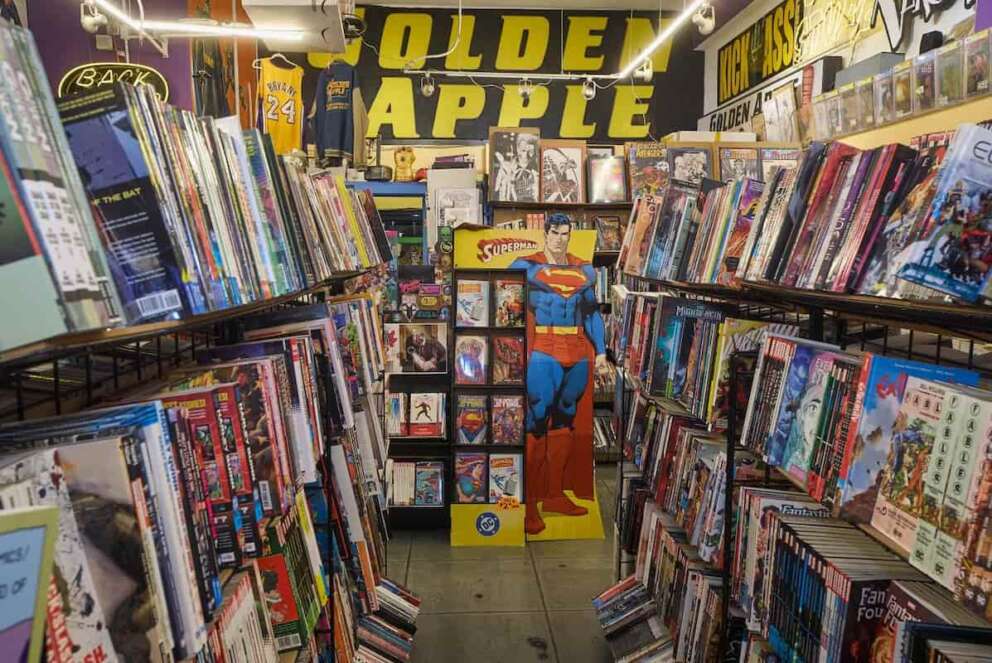A life-sized cutout of Superman is seen amidst shelves of graphic novels and pop culture memorabilia inside the iconic Golden Apple Comics store, Tuesday, Nov. 18, 2025, in Los Angeles. (AP Photo/Damian Dovarganes)