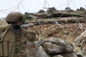 A Lebanese soldier points his rocket-propelled-grenade toward an Israeli Merkava tank in the disputed Kfar Chouba hills along the border, south Lebanon, Friday, June 9, 2023. Israeli soldiers fired tear gas to disperse scores of protesters who pelted the troops with stones along the border with Lebanon Friday, leaving some Lebanese demonstrators and troops suffering breathing problems. (AP Photo/Mohammad Zaatari) Associated Press/LaPresse Only Italy and Spain