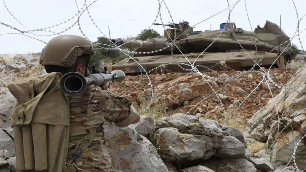 A Lebanese soldier points his rocket-propelled-grenade toward an Israeli Merkava tank in the disputed Kfar Chouba hills along the border, south Lebanon, Friday, June 9, 2023. Israeli soldiers fired tear gas to disperse scores of protesters who pelted the troops with stones along the border with Lebanon Friday, leaving some Lebanese demonstrators and troops suffering breathing problems. (AP Photo/Mohammad Zaatari) Associated Press/LaPresse Only Italy and Spain