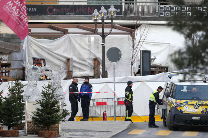 Security stands in front of the sealed off Le Constellation bar, where a devastating fire left dead and injured during the New Year’s celebrations in Crans-Montana, Swiss Alps, Switzerland, Friday morning, Jan. 2, 2026. (AP Photo/ Antonio Calanni) 


Associated Press / LaPresse
Only italy and spain