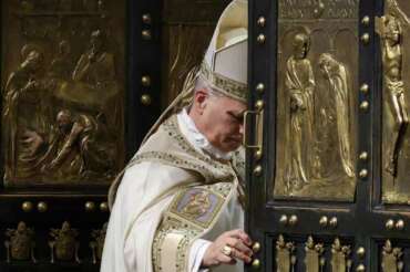 Pope Leo XIV closes St. Peter’s Basilica Holy Door to end the 2025 ordinary Jubilee year, at the Vatican, Tuesday, Jan. 6, 2026. (Yara Nardi/Pool photo via AP)