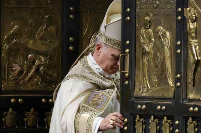 Pope Leo XIV closes St. Peter’s Basilica Holy Door to end the 2025 ordinary Jubilee year, at the Vatican, Tuesday, Jan. 6, 2026. (Yara Nardi/Pool photo via AP)