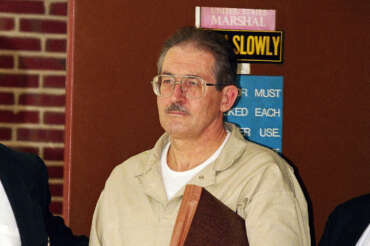 FILE – Former CIA agent Aldrich Ames leaves federal court after pleading guilty to espionage and tax evasion conspiracy charges April 28, 1994, in Alexandria, Va. (AP Photo/Wilfredo Lee, File)