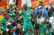 Senegal’s Sadio Mane holds the trophy aloft as he celebrates with teammates after winning the Africa Cup of Nations final soccer match between Senegal and Morocco in Rabat, Morocco, Sunday, Jan. 18, 2026. (AP Photo/Youssef Loulidi)