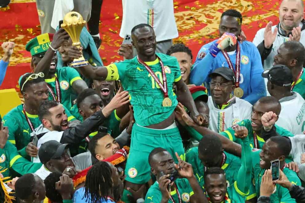 Senegal’s Sadio Mane holds the trophy aloft as he celebrates with teammates after winning the Africa Cup of Nations final soccer match between Senegal and Morocco in Rabat, Morocco, Sunday, Jan. 18, 2026. (AP Photo/Youssef Loulidi)
