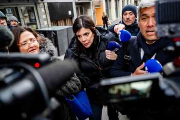Jessica Moretti, the owner of the bar in Crans-Montana, where the deadly fire happened on New Year’s Day, center, arrives with lawyers to be auditioned by the Valais public prosecutor’s office in Sion, Switzerland, Wednesday, Jan. 21, 2026. (Jean-Christophe Bott/Keystone via AP) Associate Press/ LaPresse Only Italy and Spain