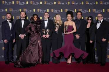 Andy Jurgensen, from left, Leonardo DiCaprio, Teyana Taylor, Paul Thomas Anderson, Sara Murphy, Chase Infiniti, Benicio Del Toro, Cassandra Kulukundis, and Michael Bauman pose with the awards for best director, cinematography, and adapted screenplay for ‘One Battle After Another’ at the 79th British Academy Film Awards, BAFTA’s, in London, Sunday, Feb. 22, 2026. (AP Photo/Alastair Grant)