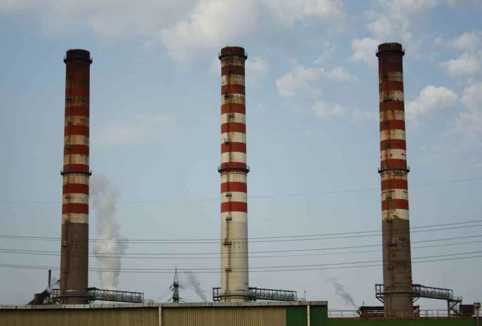FILE – In this file picture taken on Aug. 17, 2012, a partial view of the ILVA steel plant is seen in Taranto, Italy. Brothers Fabio Riva and Nicola Riva, the former owner and managers of the Ilva steel plant in the southern city of Taranto, once Europe’s largest, were convicted of criminal association aimed at provoking an environmental disaster, poisoning the food supply and willful omissions of workplace safety measures. They were sentenced to 22 years and 20 years, respectively. Two other managers were also found guilty in the case and sentenced to more than two decades, among the 24 former managers convicted in the five-year trial. (AP Photo/Paola Barisani)