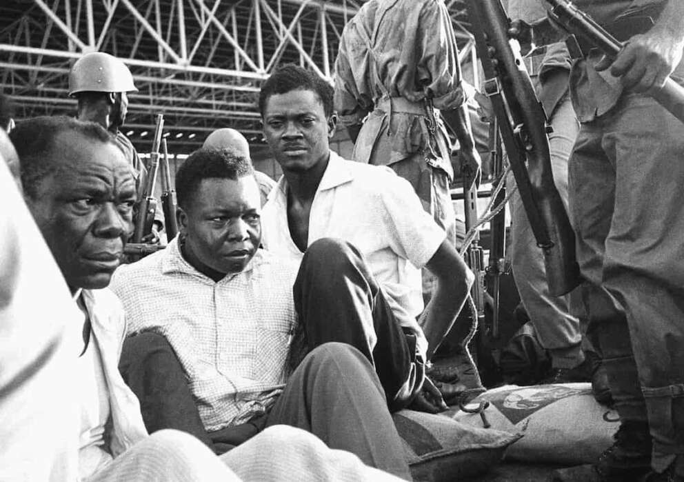 Congo’s former prime minister Patrice Lumumba, center right, with hands tied behind his back, sits in a truck upon arrival at Leopoldville (now Kinshasa) Airport in Congo, Dec. 2, 1960, following his arrest the previous day. On Monday, more than sixty one years after his death, the mortal remains of Congo’s first democratically elected prime minister Patrice Lumumba will be handed over to his children during an official ceremony in Belgium. (AP Photo, File)