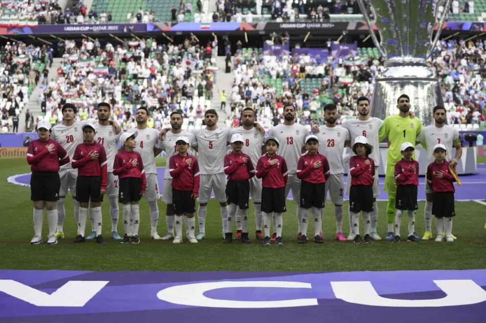 Team Iran stands for their national anthem before the Asian Cup quarterfinal soccer match between Japan and Iran at Education City Stadium in Al Rayyan, Qatar, Saturday, Feb. 3, 2024. (AP Photo/Aijaz Rahi)