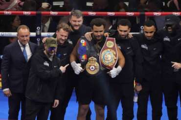 Britain’s Moses Itauma, center, celebrates after beating Australia’s Demsey McKean in their heavyweight boxing fight in Riyadh, Saudi Arabia, Saturday, Dec. 21, 2024. (AP Photo/Frank Augstein)
