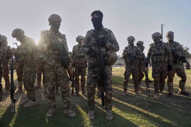 Fighters from the Syrian Democratic Forces (SDF) prepare to attend a military parade before the funeral of senior Kurdistan Workers’ Party (PKK) leader Nuredin Sofi, whose body was returned from Iraq’s Kurdistan region after he was killed in a strike on Mount Gara in April 2021, in Qamishli, northeastern Syria, Tuesday, Aug. 12, 2025. (AP Photo/Baderkhan Ahmad) Associated Press / LaPresse Only italy and spain