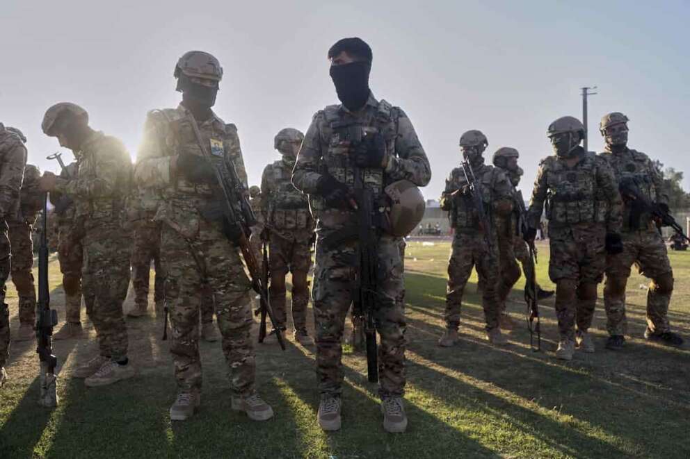 Fighters from the Syrian Democratic Forces (SDF) prepare to attend a military parade before the funeral of senior Kurdistan Workers’ Party (PKK) leader Nuredin Sofi, whose body was returned from Iraq’s Kurdistan region after he was killed in a strike on Mount Gara in April 2021, in Qamishli, northeastern Syria, Tuesday, Aug. 12, 2025. (AP Photo/Baderkhan Ahmad) Associated Press / LaPresse Only italy and spain