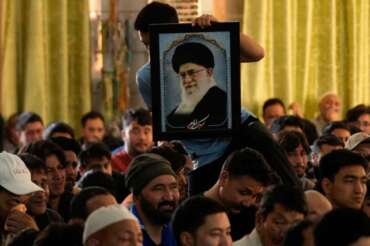 Shiite Muslims mourn the killing of Iranian Supreme Leader Ayatollah Ali Khamenei during a special prayer in Jammu, India, Sunday, March 1, 2026. (AP Photo/Channi Anand)
