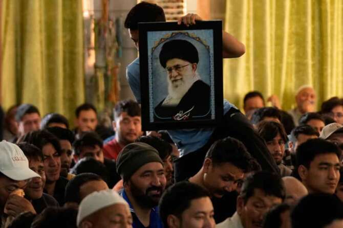 Shiite Muslims mourn the killing of Iranian Supreme Leader Ayatollah Ali Khamenei during a special prayer in Jammu, India, Sunday, March 1, 2026. (AP Photo/Channi Anand)