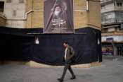 A man walks by a picture of the late Iranian Supreme Leader Ayatollah Ali Khamenei hanging on a black sheet along the side of a mosque in Tehran, Iran, Tuesday, March 2, 2026. (AP Photo/Vahid Salemi) Associate Press/ LaPresse Only Italy and Spain
