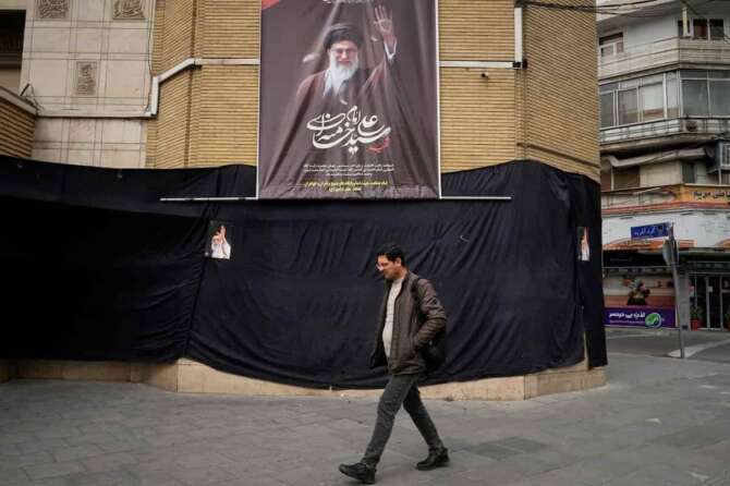 A man walks by a picture of the late Iranian Supreme Leader Ayatollah Ali Khamenei hanging on a black sheet along the side of a mosque in Tehran, Iran, Tuesday, March 2, 2026. (AP Photo/Vahid Salemi) Associate Press/ LaPresse Only Italy and Spain