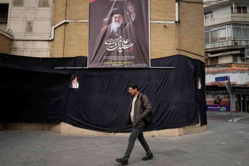 A man walks by a picture of the late Iranian Supreme Leader Ayatollah Ali Khamenei hanging on a black sheet along the side of a mosque in Tehran, Iran, Tuesday, March 2, 2026. (AP Photo/Vahid Salemi) Associate Press/ LaPresse Only Italy and Spain