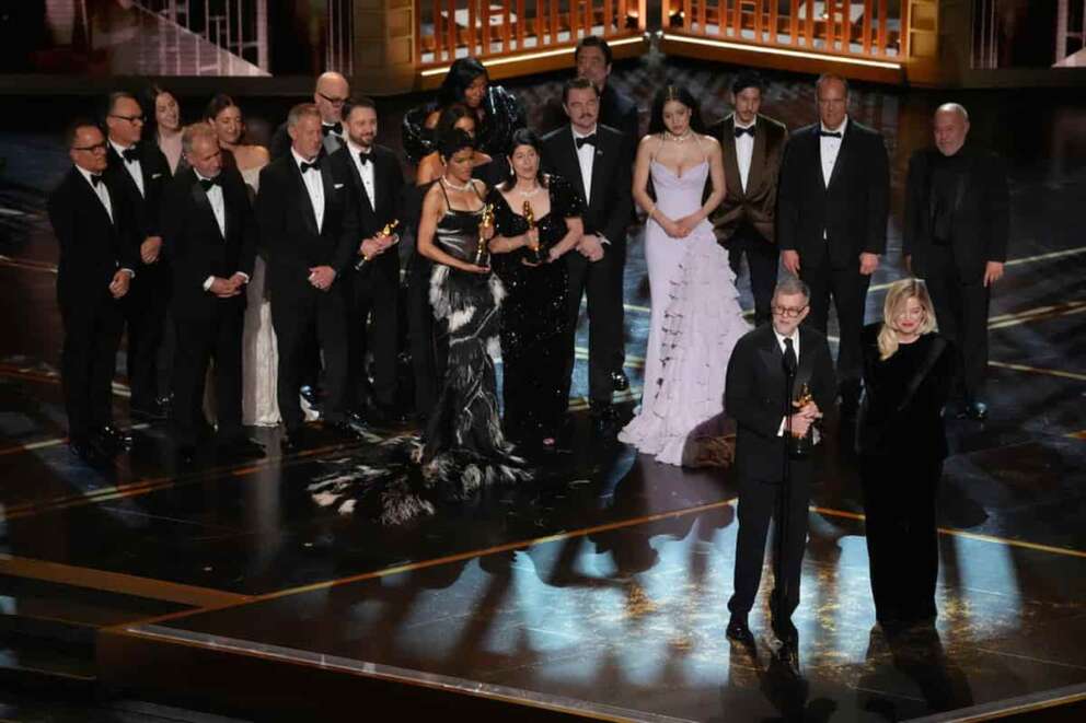 Paul Thomas Anderson, left center, Sara Murphy, right center, and the team from “One Battle After Another” accept the award for best picture during the Oscars on Sunday, March 15, 2026, at the Dolby Theatre in Los Angeles. (AP Photo/Chris Pizzello)