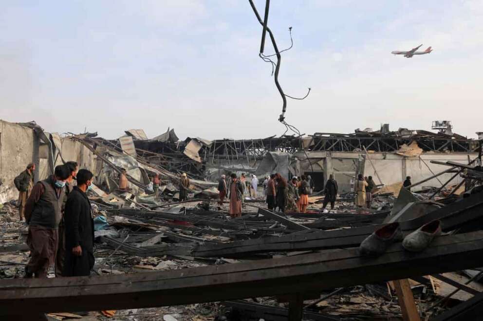 Residents and volunteers inspect the site of a late-Monday airstrike at a drug rehabilitation hospital in Kabul, Afghanistan, Tuesday, March 17, 2026. (AP Photo/Siddiqullah Alizai)