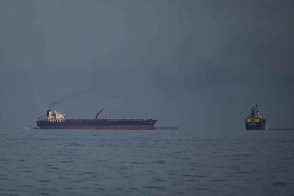 Oil tankers and cargo ships line up in the Strait of Hormuz as seen from Khor Fakkan, United Arab Emirates, Wednesday, March 11, 2026. (AP Photo/Altaf Qadri)