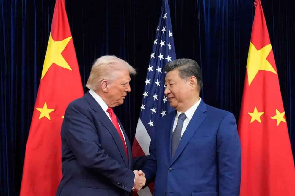 President Donald Trump, left, and Chinese President Xi Jinping, right, shake hands before their meeting at Gimhae International Airport in Busan, South Korea, Thursday, Oct. 30, 2025. (AP Photo/Mark Schiefelbein)