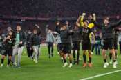 PSG players celebrate after the Champions League semifinal second leg soccer match between Bayern Munich and Paris Saint Germain in Munich, Germany, Wednesday, May 6, 2026. (AP Photo/Martin Meissner)