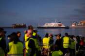 Media and emergency services personnel work next the hantavirus-stricken cruise ship MV Hondius after its arrival at the port of Granadilla in Tenerife, Canary Islands, Spain, Sunday, May 10, 2026. (AP Photo/Manu Fernandez)