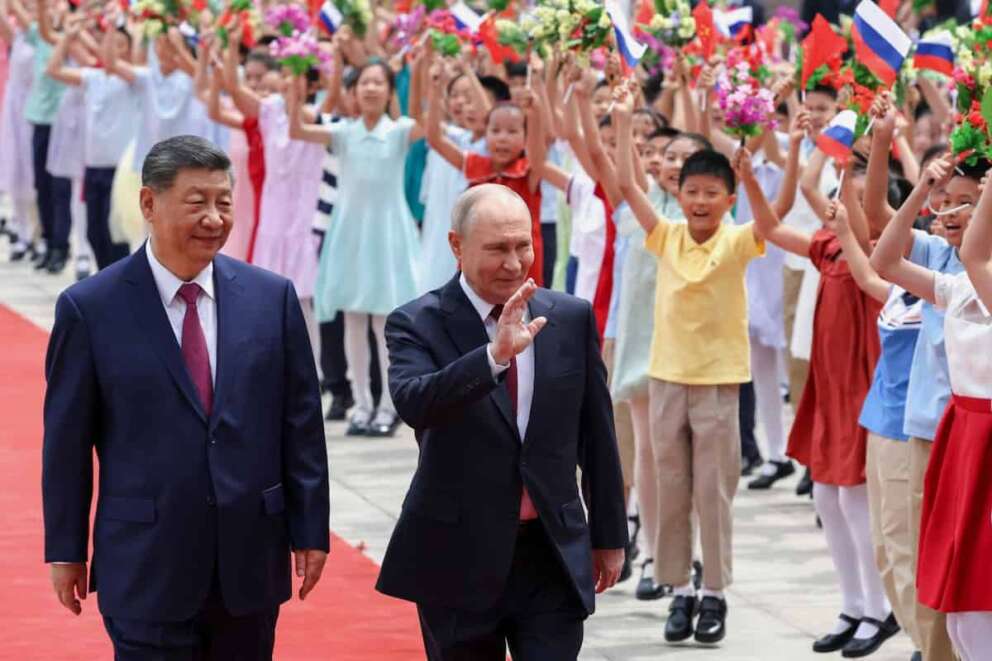 Russian President Vladimir Putin, center, and Chinese President Xi Jinping attend a welcome ceremony at the Great Hall of the People, in Beijing, China, on Wednesday, May 20, 2026. (Alexander Kazakov, Sputnik, Kremlin Pool Photo via AP)