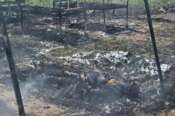 EDS NOTE: GRAPHIC CONTENT – The remains of a body lie on the ground at an Ebola treatment center after it burned down in Rwampara, Ituri province, Congo, Thursday, May 21, 2026. (AP Photo/Dirole Lotsima Dieudonne) Associate Press/ LaPresse Only Italy and Spain