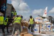 Workers offload medical and emergency supplies donated by European Union to support frontline workers in fighting Ebola upon arrival at the national airport in Bunia, Congo. Thursday, May 28, 2026. (AP Photo/Moses Sawasawa)