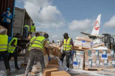 Workers offload medical and emergency supplies donated by European Union to support frontline workers in fighting Ebola upon arrival at the national airport in Bunia, Congo. Thursday, May 28, 2026. (AP Photo/Moses Sawasawa)