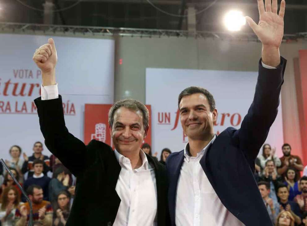 Spanish Socialist Workers Party (PSOE) leader Pedro Sanchez (R), presidential candidate for the upcoming general elections, and former Spanish Prime Minister Jose Luis Rodriguez Zapatero (L), react during an election campaign event in Gijon, northern Spain, 10 December 2015. Spain will hold a general election on 20 December 2015. EFE/J.L. Cereijido