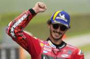 Italy’s Francesco Bagnaia celebrates after winning the sprint race for the MotoGP Grand Prix of Italy at the Mugello circuit in Scarperia, Italy, Saturday, June 10, 2023. (AP Photo/Luca Bruno)
